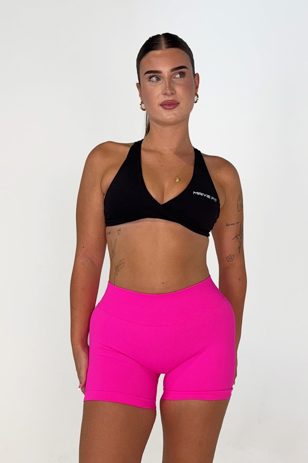 Maivie Fit Twist Crop in Deep Black paired wth Hot Pink Shorts