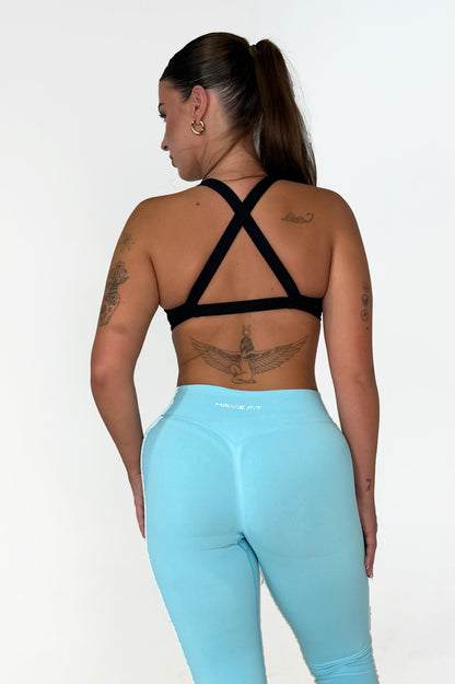 Maivie Fit Twist Crop in Deep Black paired wth Ice Blue Leggings