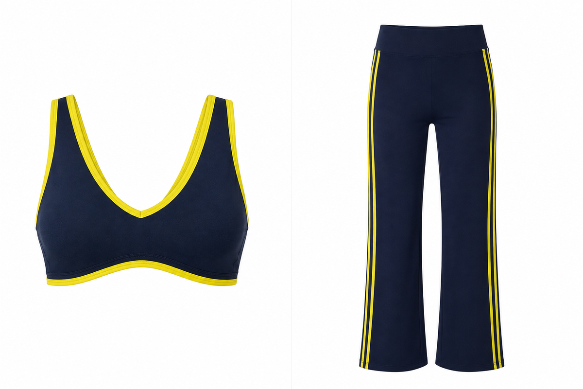 A two-piece athletic set featuring a navy blue sports bra with bright yellow trim and matching navy blue wide-leg pants with yellow side stripes, shown against a plain white background.